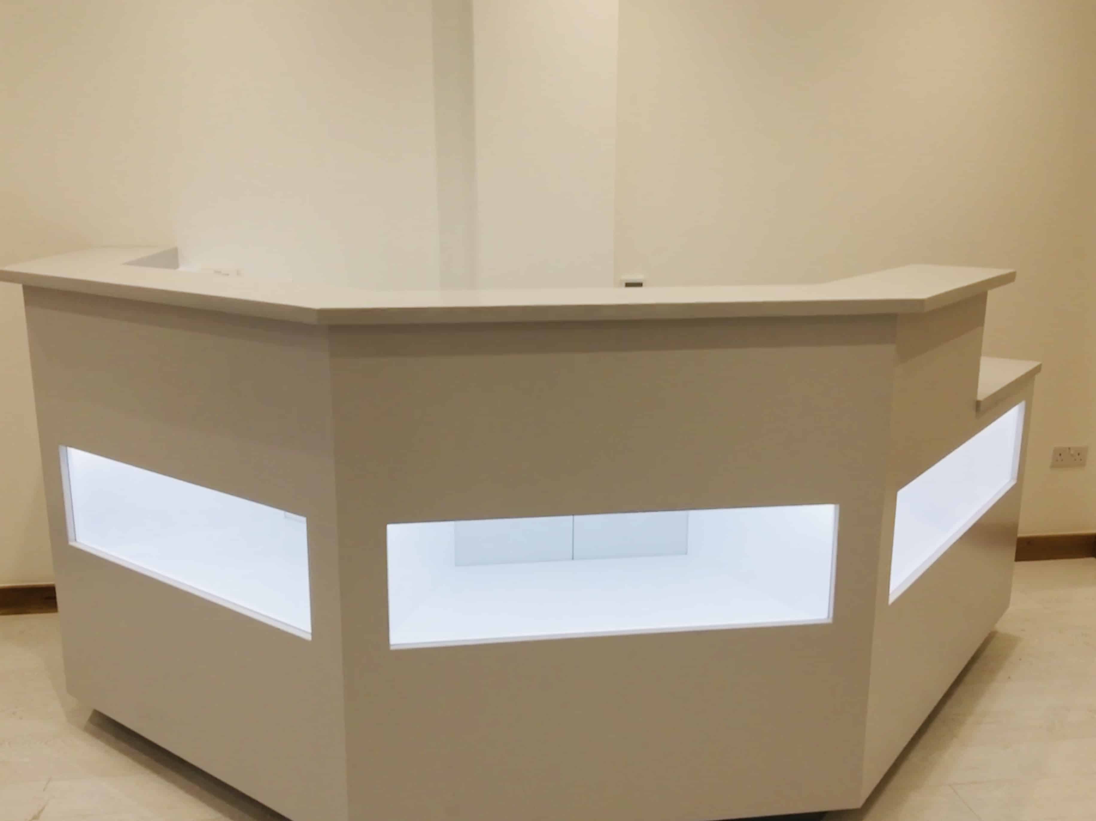 Reception desk with glass window in spa clinic.