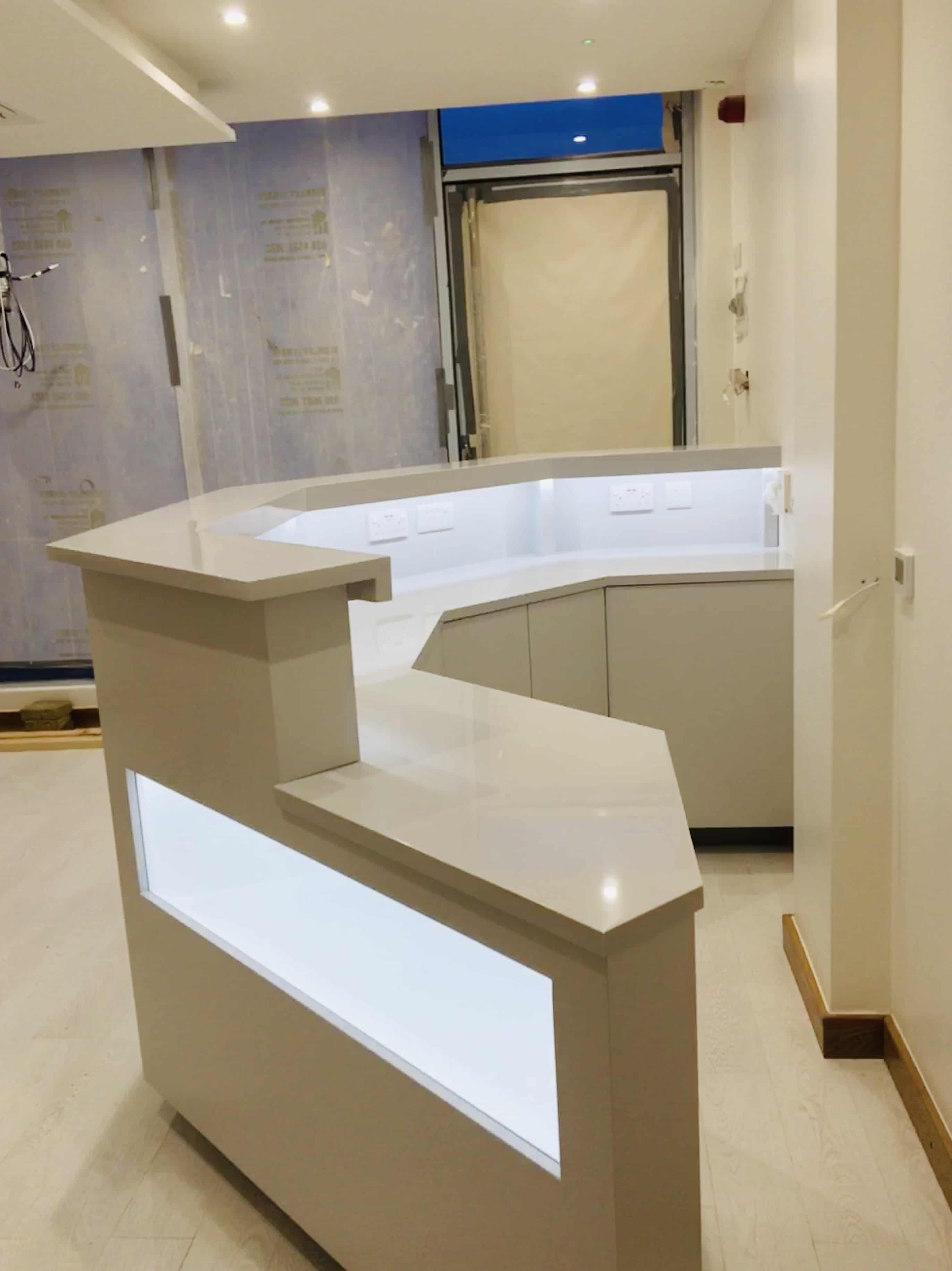 Reception desk with glass window in spa clinic.