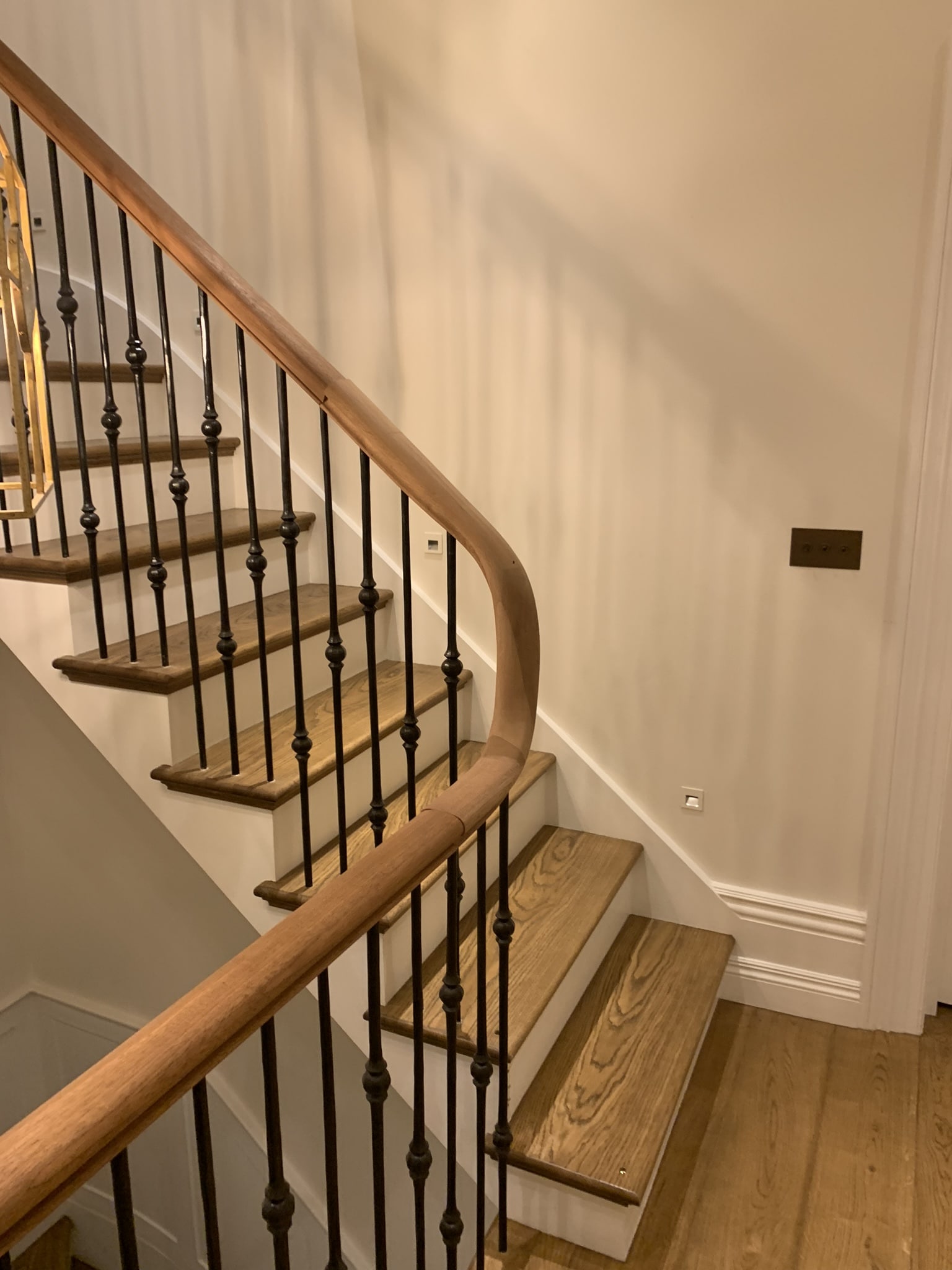Special design of curved handrail. Hardwood.