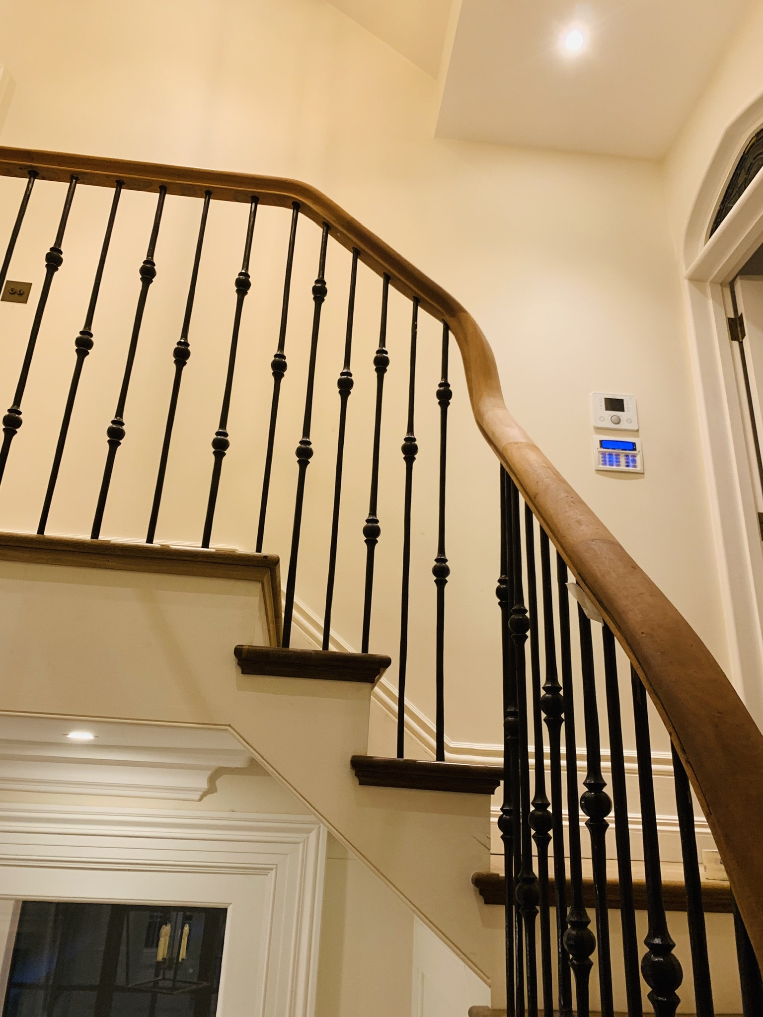 Special design of curved handrail. Hardwood.